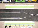 Crossover and straight flanked by track borders