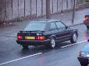 Black Ford Escort XR3i with red trim, rear and side